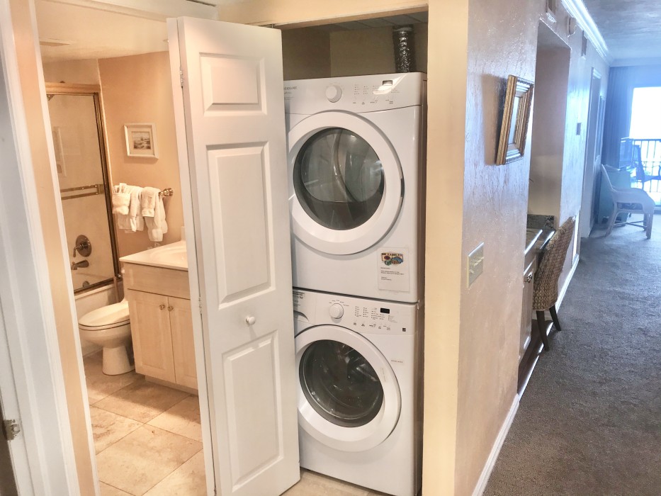 The laundry area with full size washer and dryer