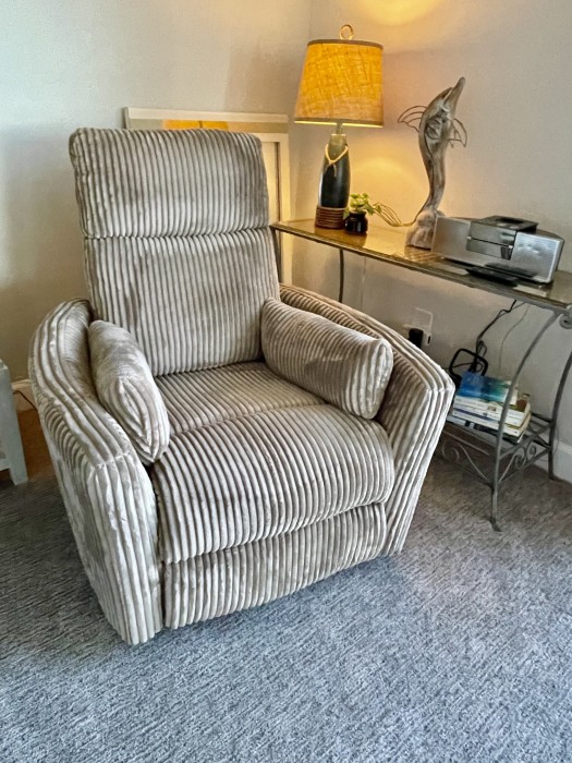 Enjoy the little brown chair while watching TV, reading, or enjoy the gulf view.