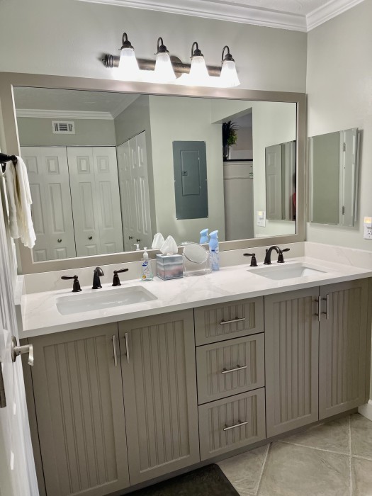 Master bath with two sinks, a walk-in shower, and you will find beach towels for use.