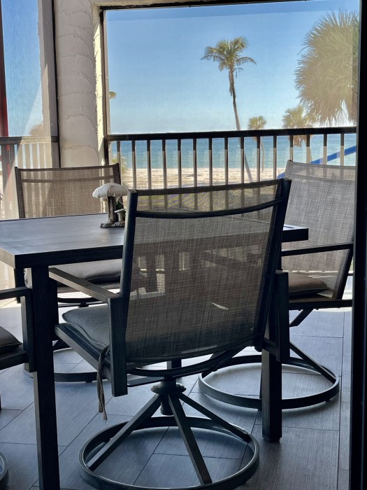 Relax on the Lanai with gulf breeze and a prime view of the Gulf, courtyard lagoon, and pool.