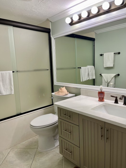 Guest bath connecting to guest bedroom, it has an oversized tub/shower.